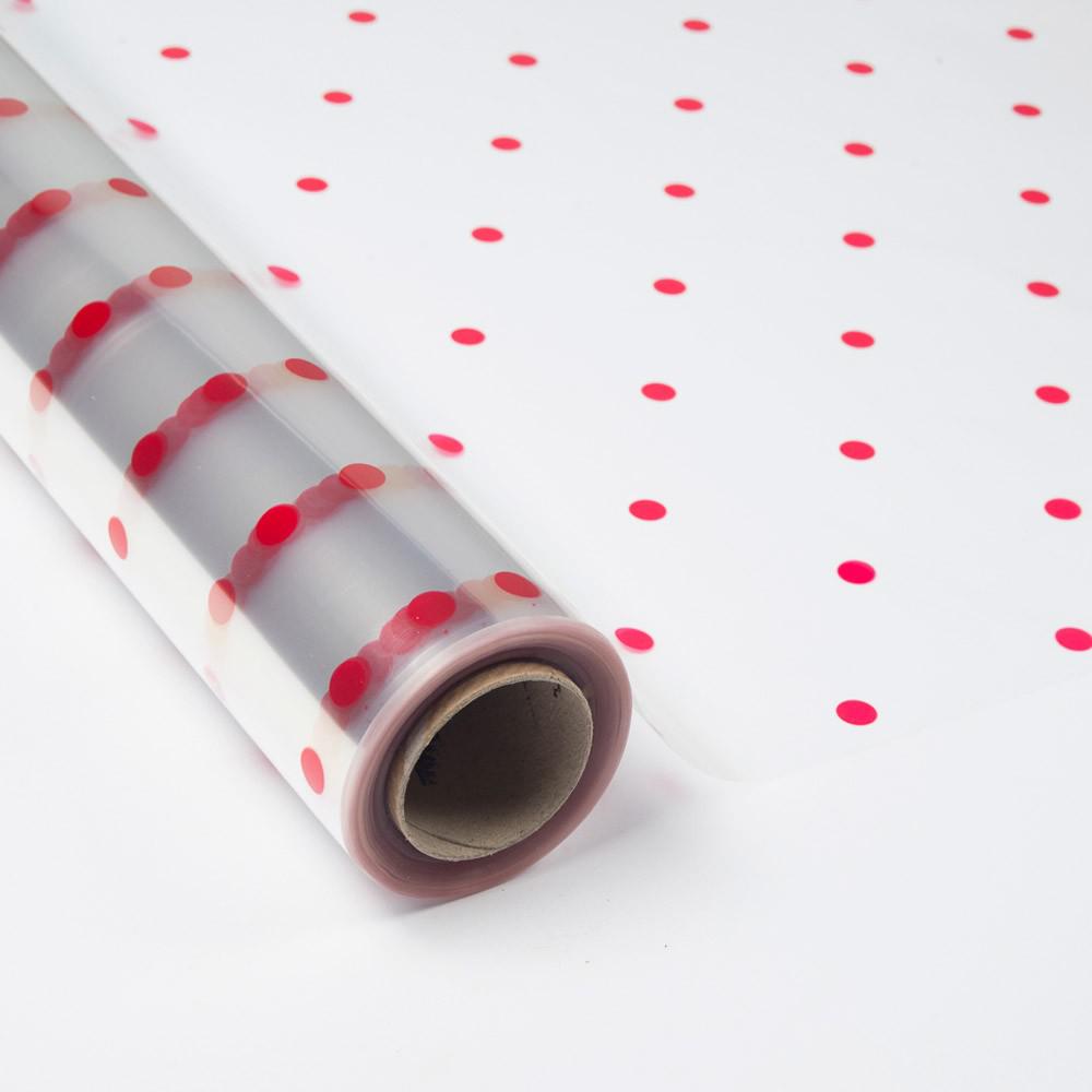 Papel de Regalo Transparente con topos rojos.