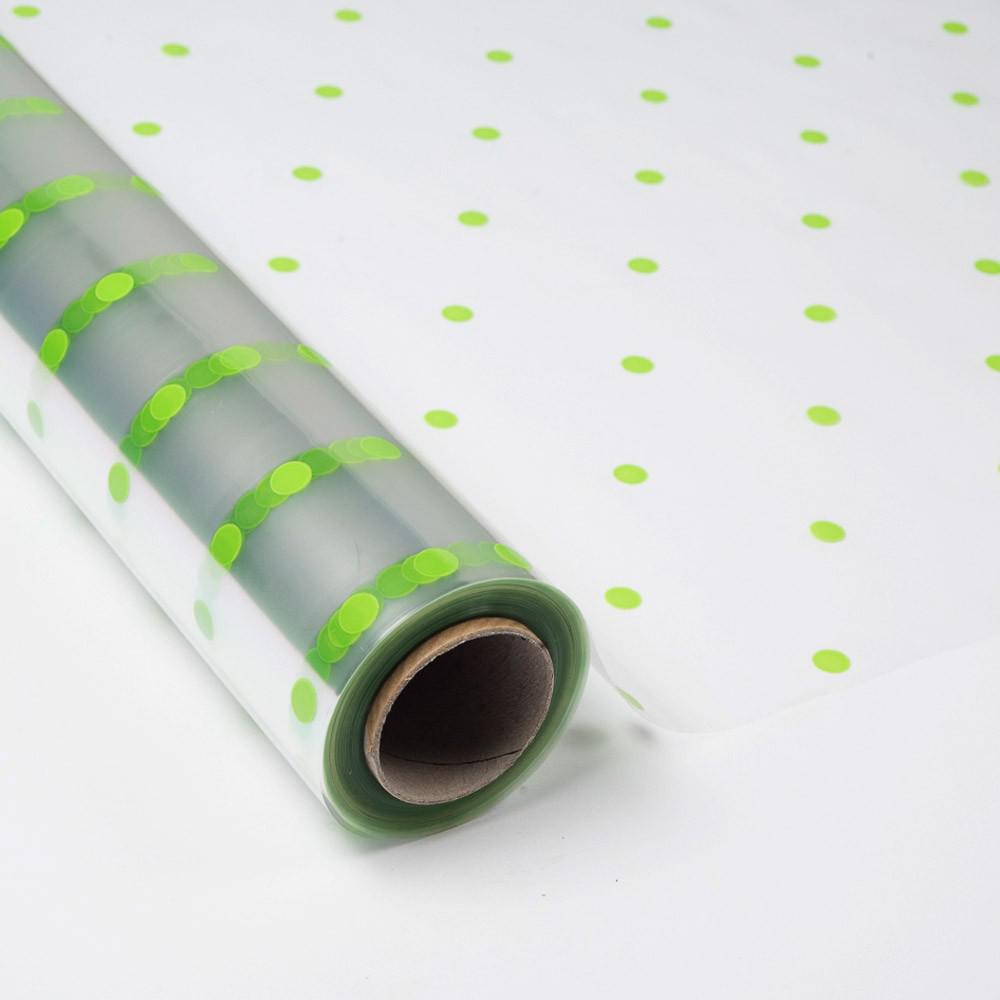 Papel de Regalo Transparente con topos Verdes.
